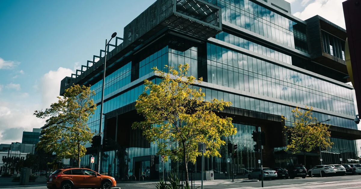 Modern glass-fronted commercial building in Dandenong, Victoria; representative property photograph.